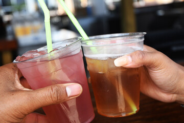 hand holding a cocktail