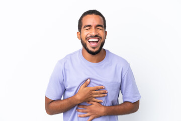 Young Ecuadorian man isolated on white background smiling a lot