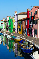 Fototapeta na wymiar Europe. Italy. Veneto. Burano. Coloured houses along canal in Burano village