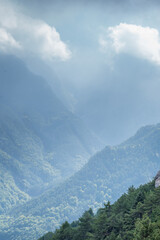 Naklejka premium Mist in the forest up to the mountains hills .autumn landscape in Greece,Olympus