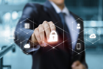 Businessman puts protection in the system on a virtual computer screen.