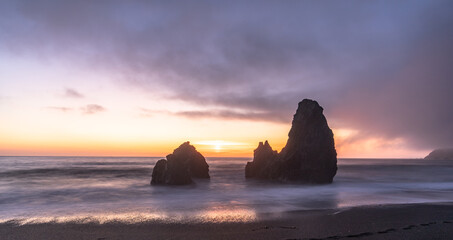 Rodeo Beach in San Francisco, sunrise on the beach, rocks, sand, waves and sun, vivid colors