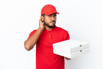 pizza delivery man picking up pizza boxes isolated on white background having doubts