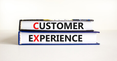 CX customer experience symbol. Concept words 'CX customer experience' on books on white table, white background, copy space. Business and CX customer experience concept.