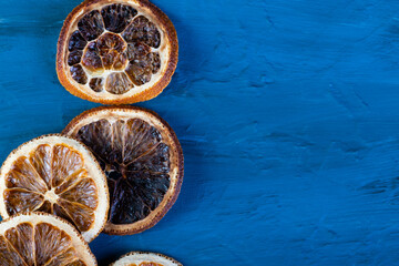 dried oranges on a dark blue slate, stone or concrete background.Christmas background, celebration, New Year's party concept. Beautiful jewelry. ingredients for making mulled wine. top view