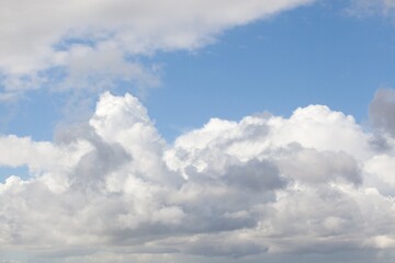 Naklejka na ściany i meble Beautiful clouds against a blue sky background.