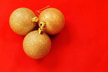 Christmas decoration. A round row of shiny balls. Still life minimalistic style. Close up and isolated on a red background. Inside. Copy space with text for your design. Stockholm, Sweden Scandinavia 