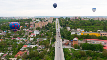 How to travel during quarantine. Hot air balloon. Colorful hot-air balloons flying over the city