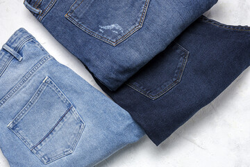 Blue jeans pants clothes pile background