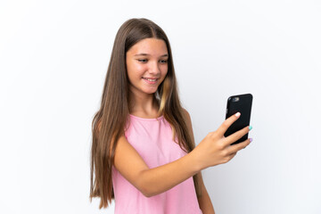 Little caucasian girl isolated on white background making a selfie