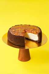 Sliced Birthday cake on the wooden cake stand. Beautiful sponge cake on the paper background. Copy space. Food photography for recipe.