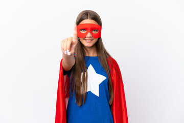 Little caucasian girl isolated on white background in superhero costume and pointing to the front