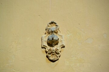Decorative element on the plastered wall of the school