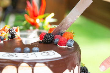 wedding chocolate cake with raspberries very close up