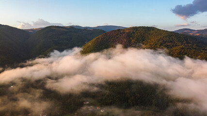 Clouds on Mountain Peak Aerial View