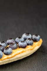 Bananas with peanut butter and berries on the top