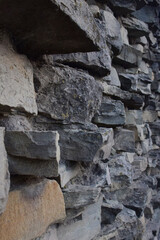 Texture lined with stone on the wall, of different shapes and shades for the whole frame