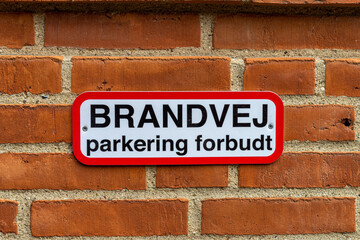 Here we see a sign on the wall, `Brandvej` translated into English, fire road, at the National Equestrian Center Vilhelmsborg