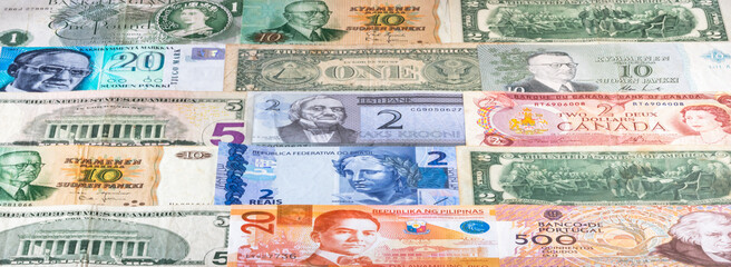 Fototapeta na wymiar Colorful background with current and old banknotes from some countries.