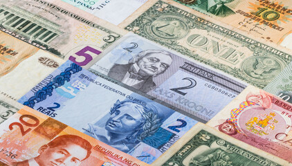 Colorful background with current and old banknotes from some countries.