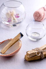 The smoking stick of the Palo Santo tree. Incense for meditation, aromatherapy, relaxation, ceremonies and rituals, cleansing and healing. Close-up, vertical format.