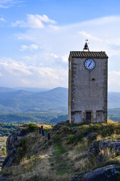 Vertical shot of a clock tower in Comarca Matarrania, Teruel province, Spain