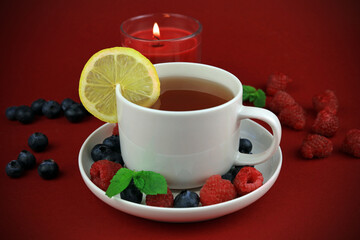 cup of tea with berries