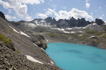 Obraz premium Amazing hiking day in one of the most beautiful area in Switzerland called Pizol in the canton of Saint Gallen. What a wonderful alpine lake called Wildsee in the Swiss alps.