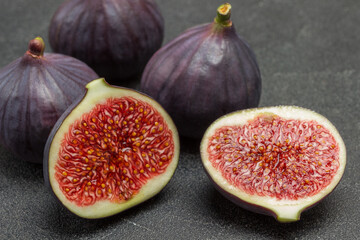 Two halves of  fig. Three whole figs