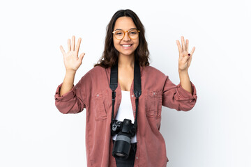 Young photographer woman over isolated white background counting nine with fingers