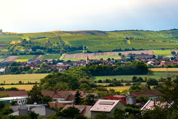 a village in the czech republic, south moravia, czech landscape, farmland in the background, bright fields