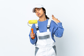 Painter woman over isolated white background with tired and sick expression