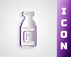 Paper cut Closed glass bottle with milk icon isolated on grey background. Paper art style. Vector