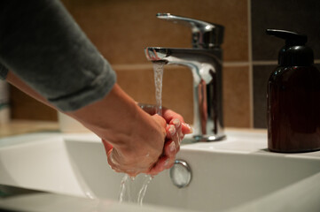 Low angle view of a woman washing her hands