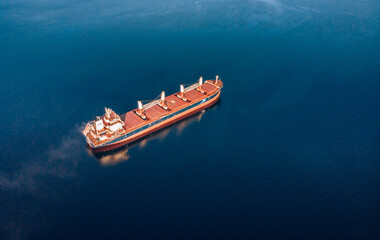 Large cargo ship in the White sea aerial view.