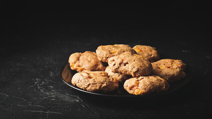 Oatmeal cookies with plum pieces. Food photo.