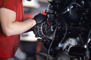 Fototapeta na wymiar car engine generator repair in a car service