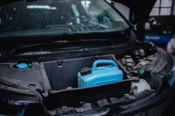 fuel canister in the trunk of an electric hybrid vehicle car