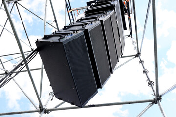 Professional sound speakers mounted for outdoor events