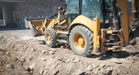Fototapeta na wymiar Excavator works at a construction site.