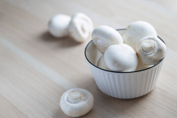 Fototapeta na wymiar mushrooms champignons in a white plate vegetarian food