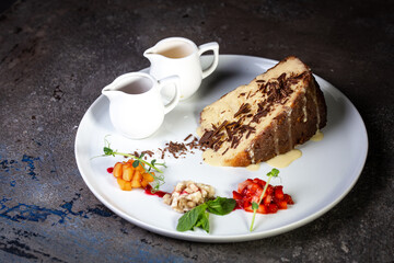 a piece of cake with condensed milk on a white plate