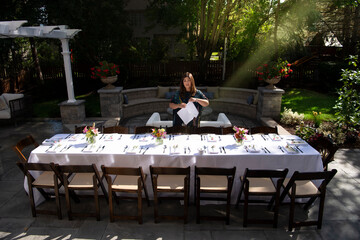 Woman Setting dinner table 