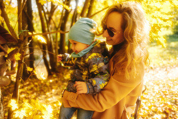 happy family walking in autumn city park