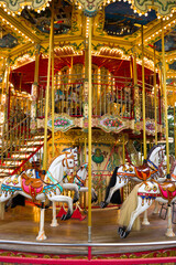 detail of the horses of an old carousel for children