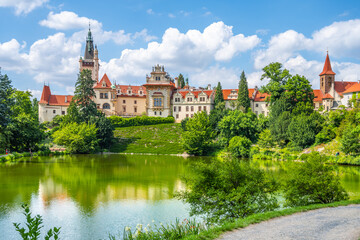 Fototapeta premium Pruhonice castle and natural park landscape with garden lake on sunny summer day, Pruhenice, Czech Republic. UNESCO World Heritage Site