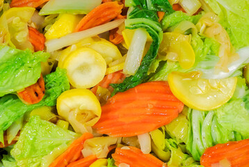 Cloae up of vegetable stir fry with carrots, onions, zucchine and chinese cabbage