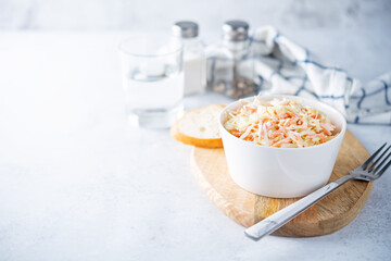 Coleslaw, cabbage carrot salad with greek yogurt dressing in a bowl
