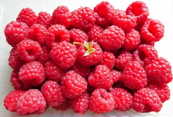 macro photo of a raspberry on a white background