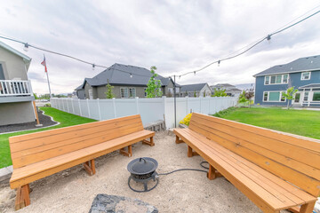 Image of an outdoor seating area with wooden chairs.